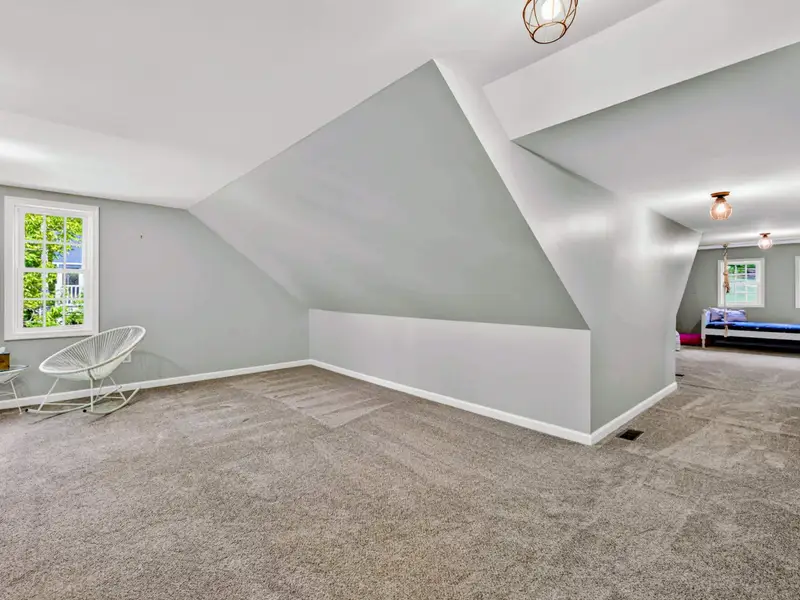 Bonus Room - Twin beds lined up under the eaves, ready for the kids' sleepover floor.