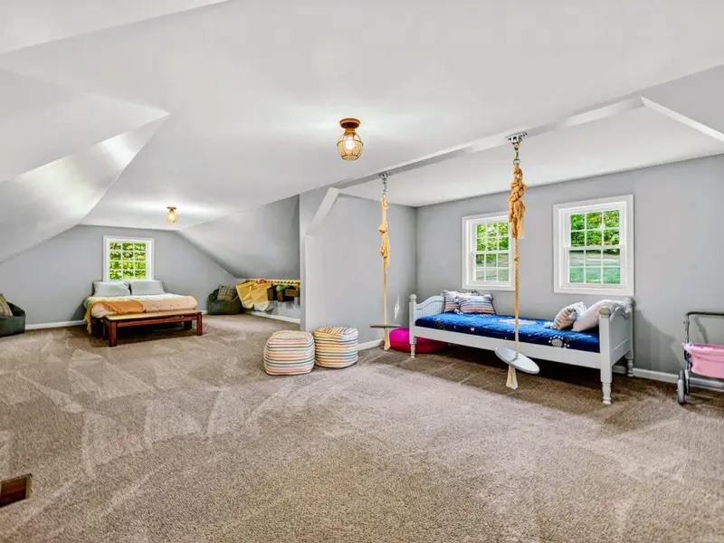 Bonus Room - Cheerful bedding, dormer light, and the kind of space younger guests immediately claim.