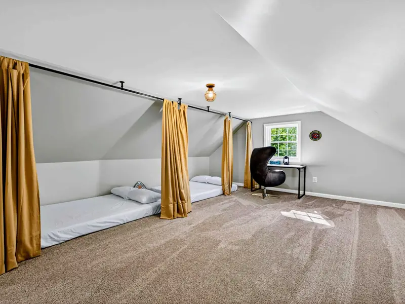 Bonus Room - The curtains separating each space provide each guest with privacy - or a great hiding spot during hide-and-seek.