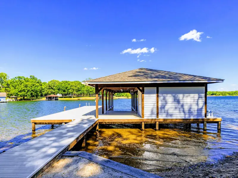 Boat Dock - The covered boat dock sits right at the edge of the cove, ready for the day on the water.