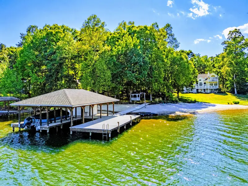 From Above - The home and boat dock from the lake side, with the deep no-wake cove in the foreground.