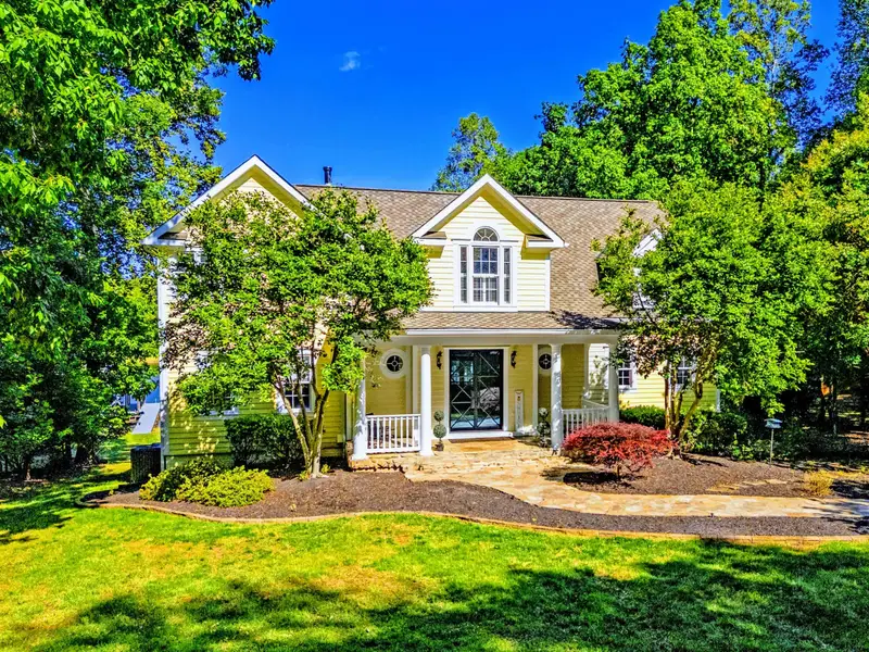 Front Facade - Classic Cape-style architecture with detailed trim work.