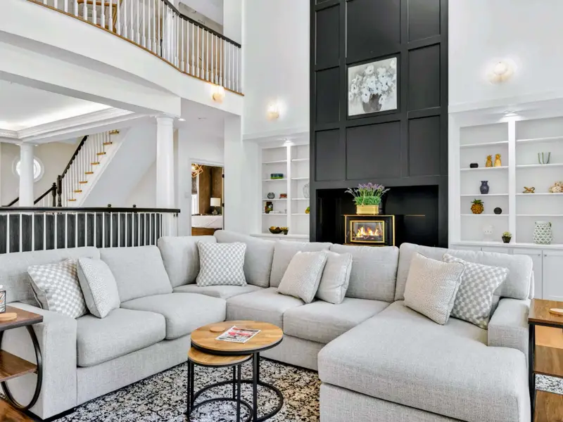 Great Room - Layered sectional and oversized rug make the room feel cozy despite the vaulted ceiling.