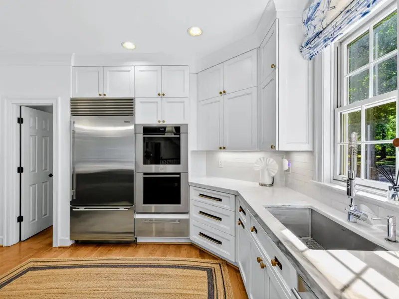 Kitchen Detail - Built-in Sub-Zero refrigerator anchors the appliance wall.