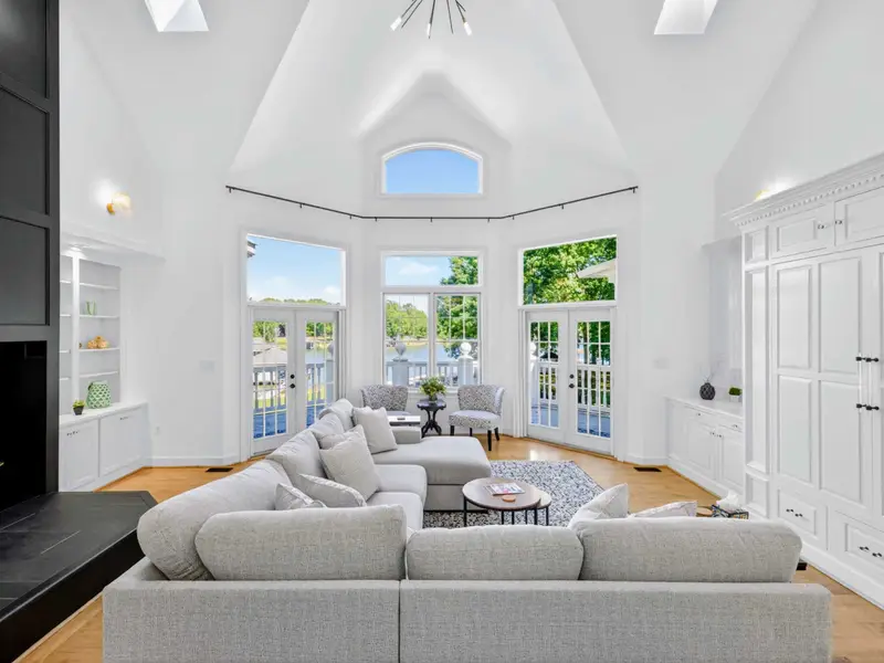 Great Room - Long view across the main living space, all sight lines pointing at the water.