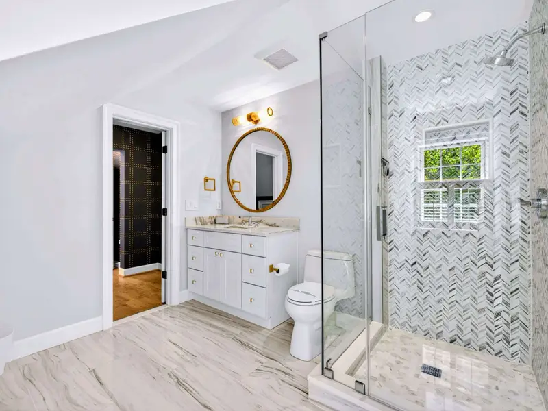 Ensuite Bath - Wide angle of the vanity, mirror, and walk-in shower.