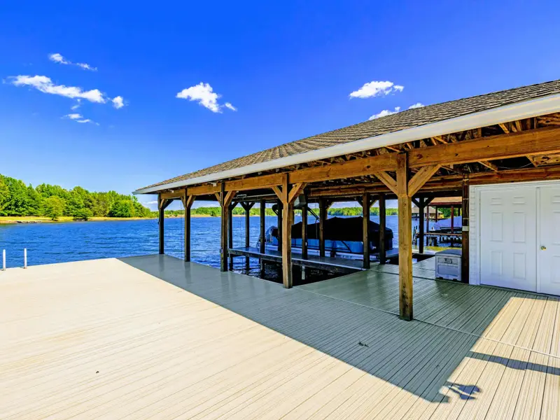 Boat Dock - Inside the covered slips, with composite decking and room for two boats plus jet skis.