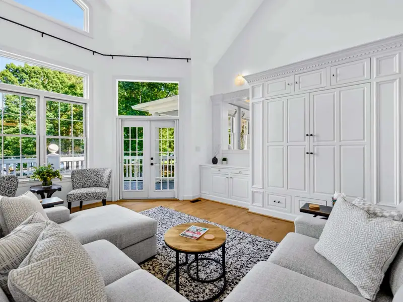Great Room - Wide angle showing the seating wrapped around the central rug.
