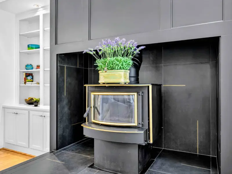 Great Room - Dark feature wall with custom built-ins and styled shelving.