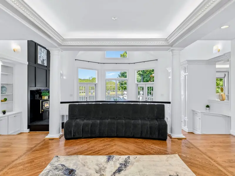 Kitchen - Marble counters, navy island, and direct sight lines to the great room.