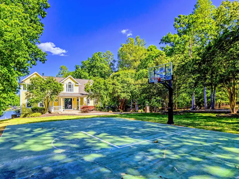 Front Approach - First view of the home through the trees as you pull up.
