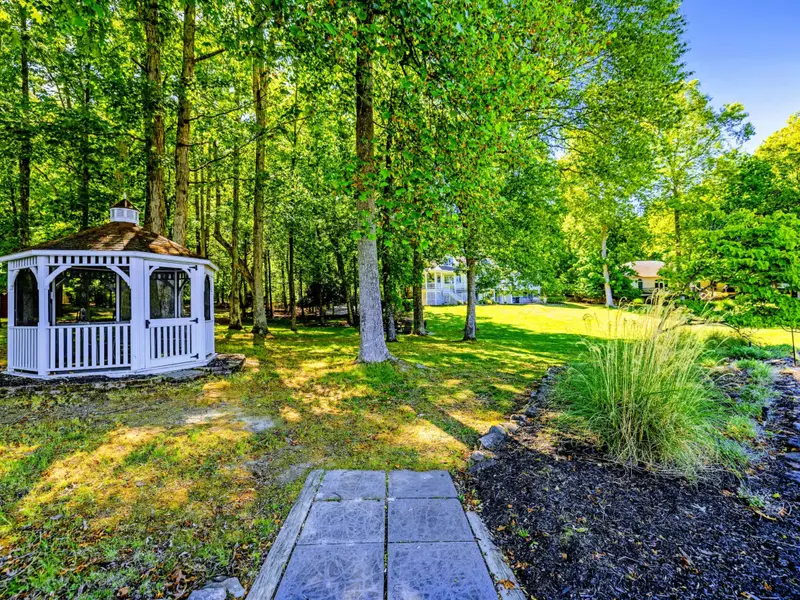 Screened Gazebo - A tucked-away lakeside gazebo for shaded reading, sunset cocktails, or a quiet phone call.