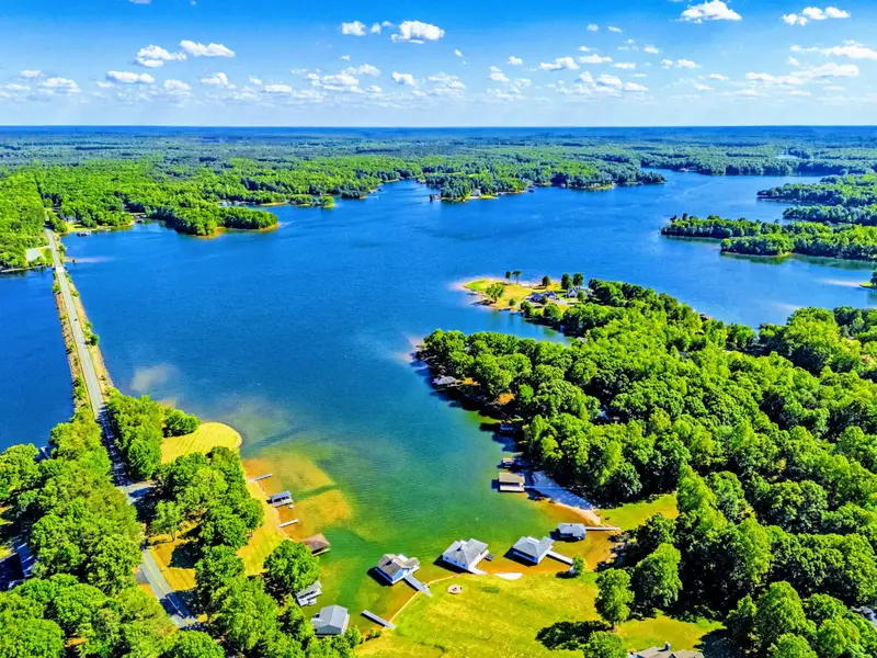 From Above - Looking out across the cove from above, with neighboring shoreline visible in the distance.