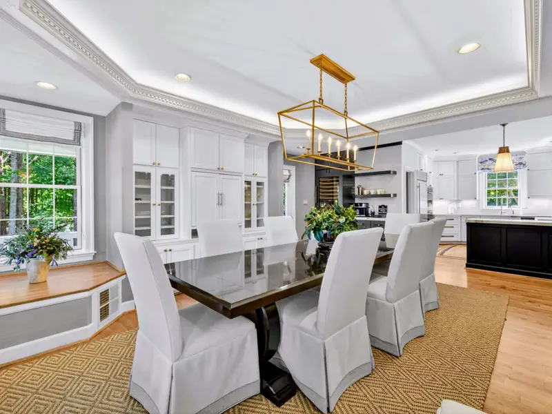 Dining Area - Seating for 10+ with views back toward the kitchen island (ten chairs in the room, two against the wall).
