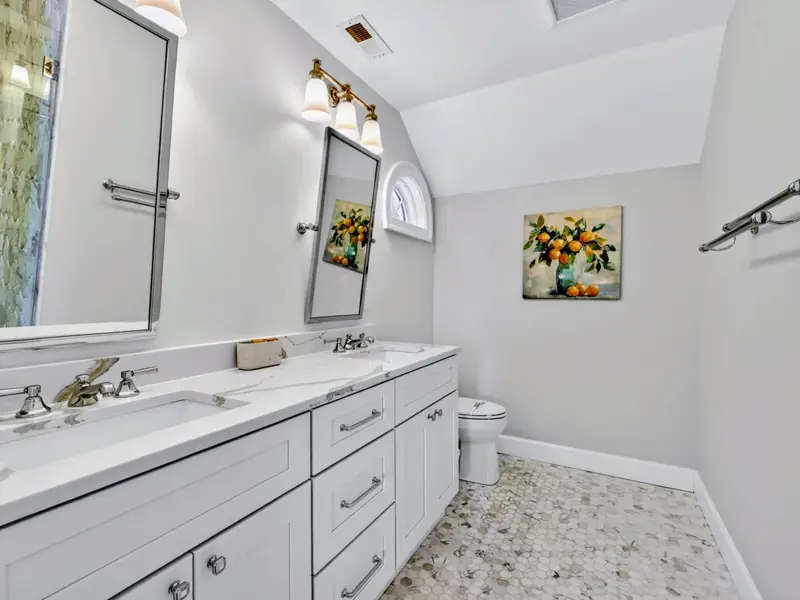 Ensuite Bath - Vanity with chrome fixtures and marble counter.