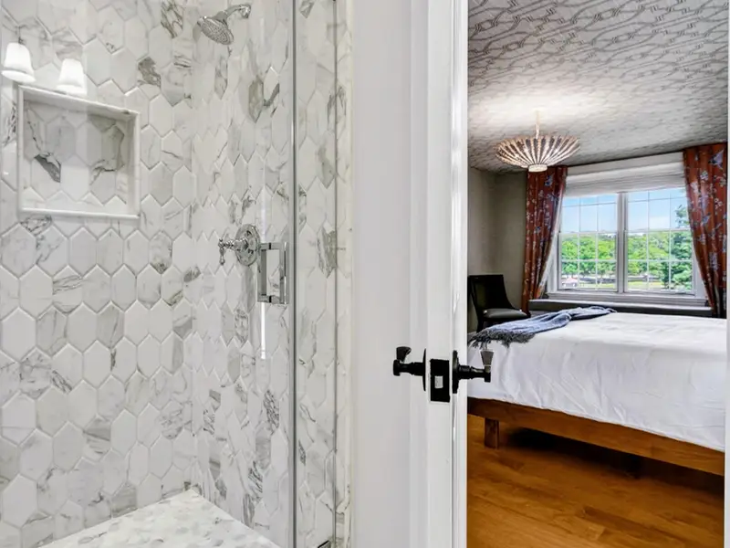 Ensuite Bath - Glass-enclosed walk-in shower keeps the bath bright and open.