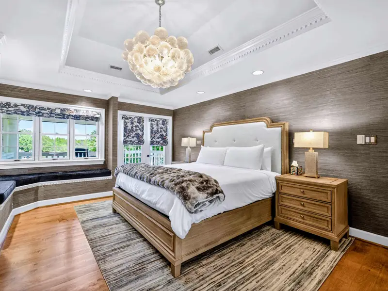Primary Suite - Designer-styled primary suite with bright window light.