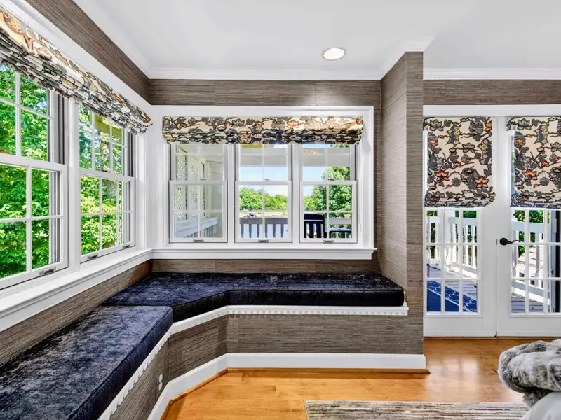 Primary Suite - The bay-window reading nook off the primary suite, with built-in bench seating.