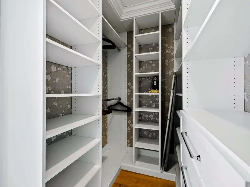 Primary Closet - Built-in shelving in the primary suite walk-in closet.