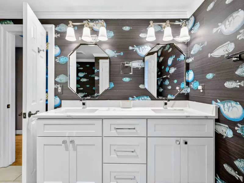 Jack-and-Jill Bath - Double vanity with chrome fixtures keeps the morning rush moving.