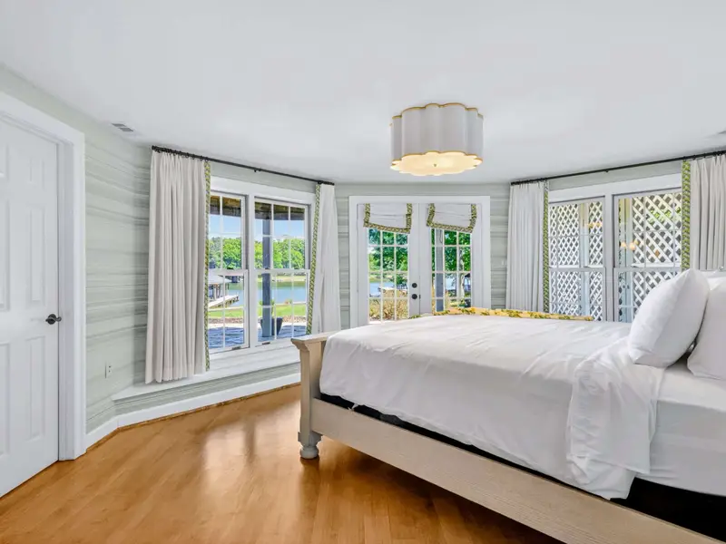 King Bedroom - Light, airy lower-level bedroom with king bed and bright daylight.