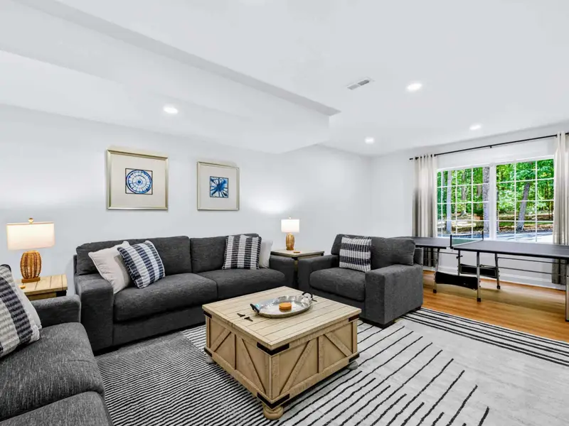 Family Room - Sectional, ottoman, and big-screen TV make this the unofficial movie room.
