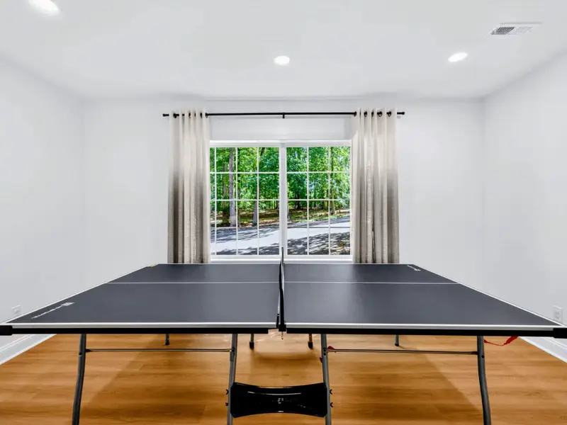 Game Room - Full-size ping pong table tucked into the lower level for quick matches.