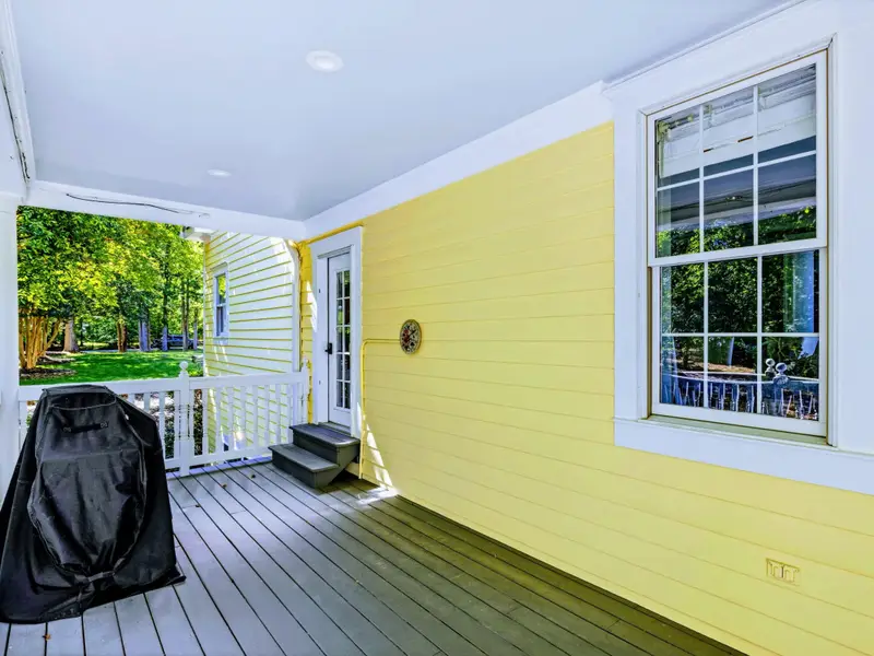 Deck - The grill is positioned right off the porch for easy lake-side cooking.