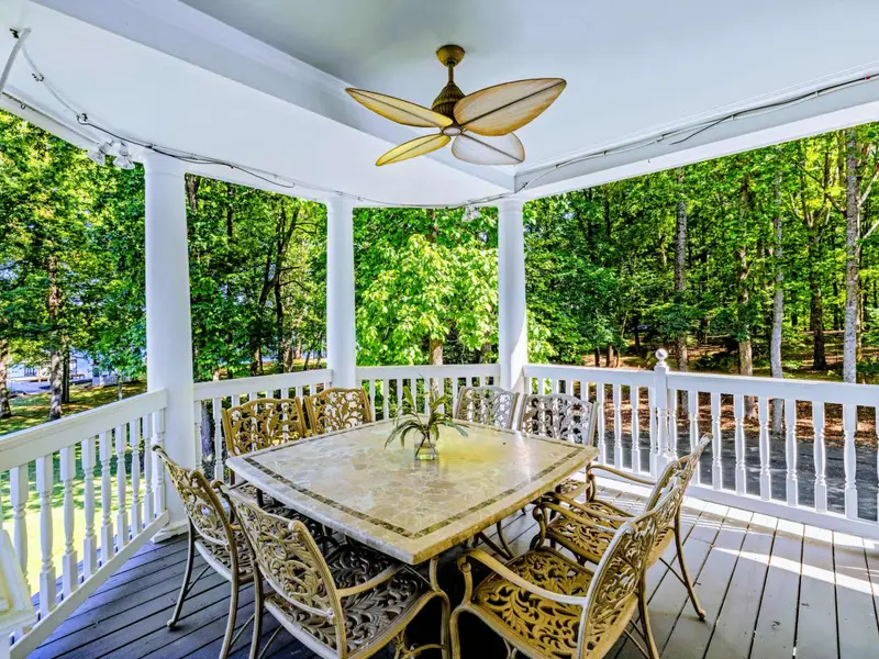 Deck - Outdoor dining for the full group, sheltered under the deep covered porch.