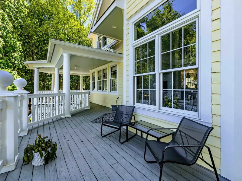 Deck - View of the dining table on the deck, perfect for outdoor breakfast with a lake view.