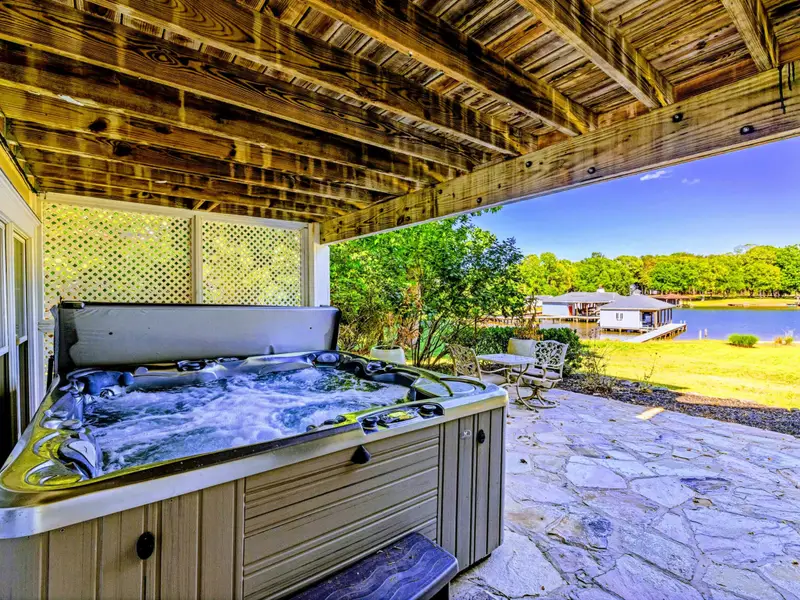 Hot Tub - Privacy-screened hot tub area, sheltered from the elements year-round.