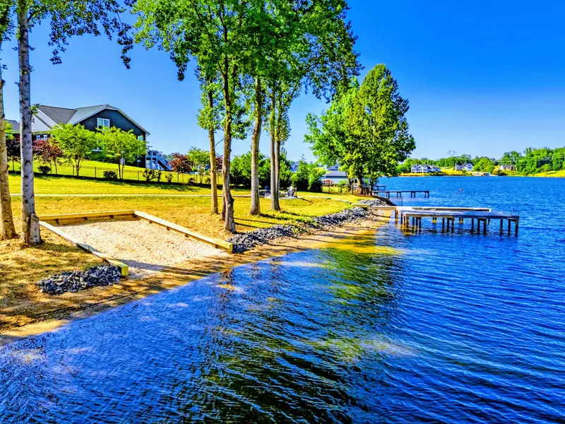 Beach and Dock - Sandy beach on one side, private dock on the other, and quiet Lake Anna water in between.