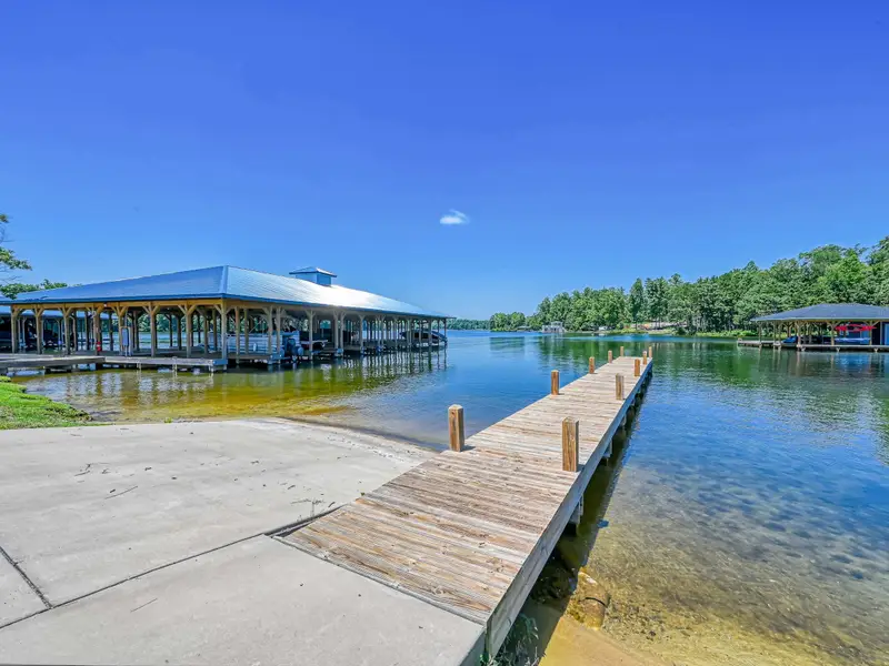 Elk Creek Landing Boat Ramp - Community boat ramp with floating dock and the covered slip pavilion at the entrance to the cove.