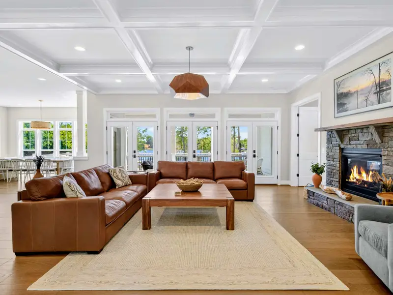 Great Room - Leather sofas gather around the wood coffee table in the open living space.