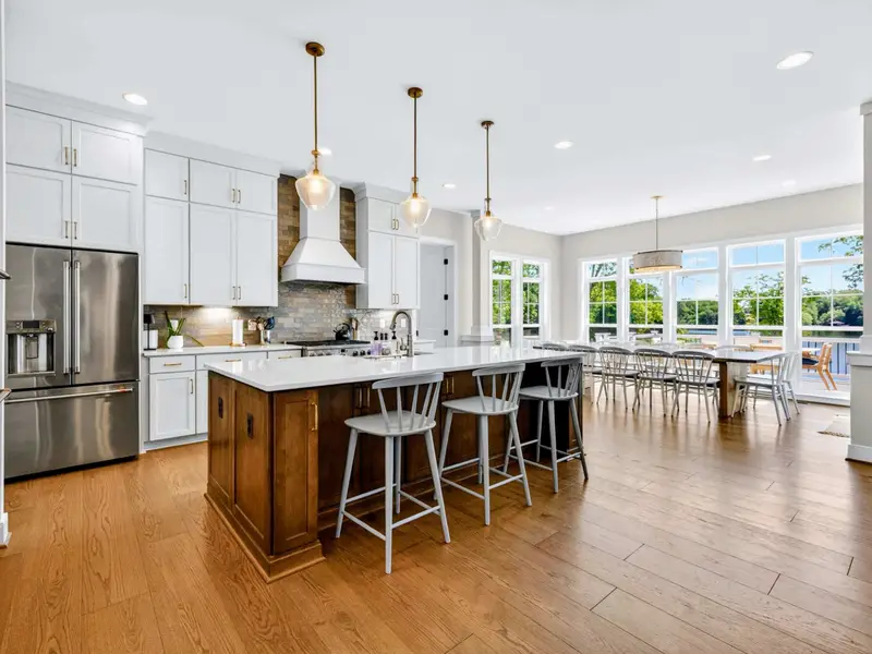 Kitchen - A French-door refrigerator and a 36-inch gas range with two ovens make cooking for a crowd easy.