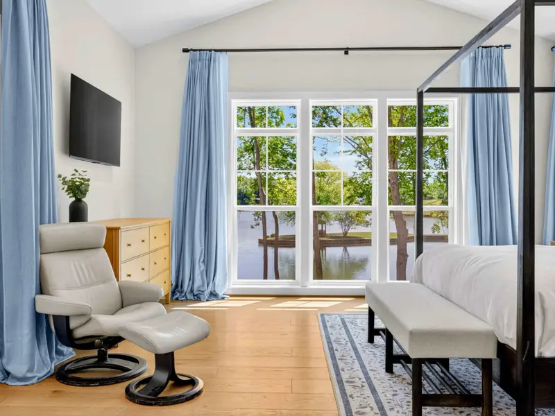 Primary Suite - A quiet sitting nook by the windows, with lake views to wake up to from the primary suite.