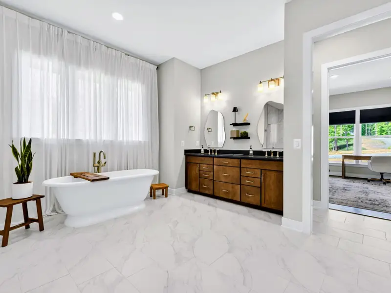 Primary Bath - A bright, airy view through to the closet and bunk room beyond.
