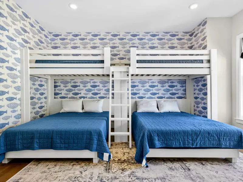 Bunk Room - A twin-over-queen bunk with coastal blue bedding, a kid favorite off the lower level.