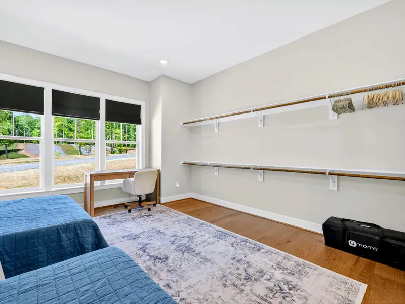 Bunk Room - Twin-over-queen bunks built into the primary suite's walk-in closet make clever extra sleeping space for guests.