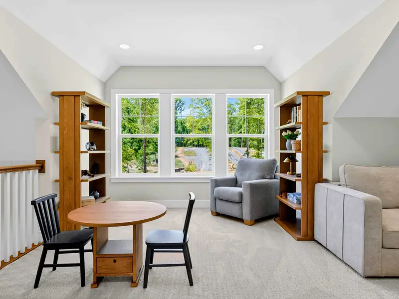 Loft - Built-in bookshelves and a kids' game table anchor the upstairs loft, a bright spot to relax with a book.