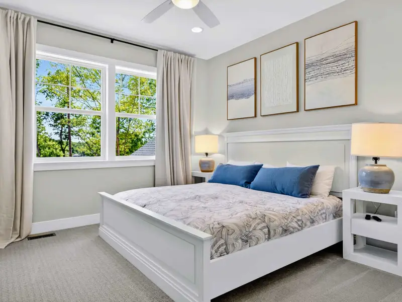 Bedroom - A wall-mounted TV faces the king bed in this comfortable room with lake views.