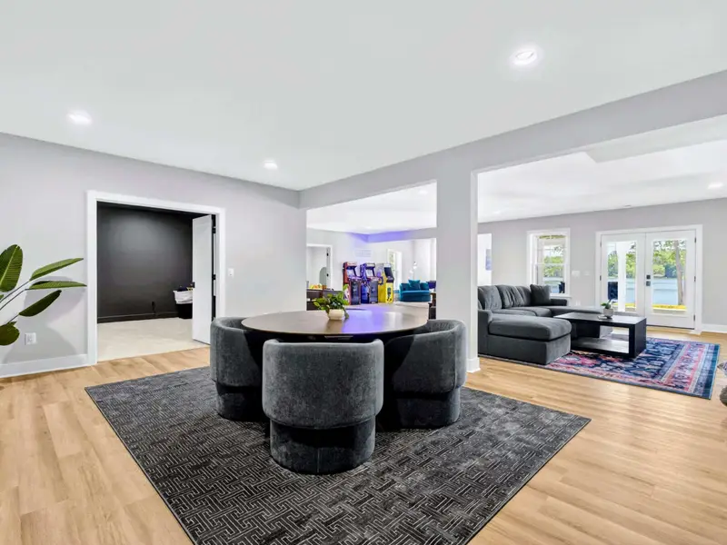 Lower-Level Lounge - A sectional and big TV anchor the walkout family room.