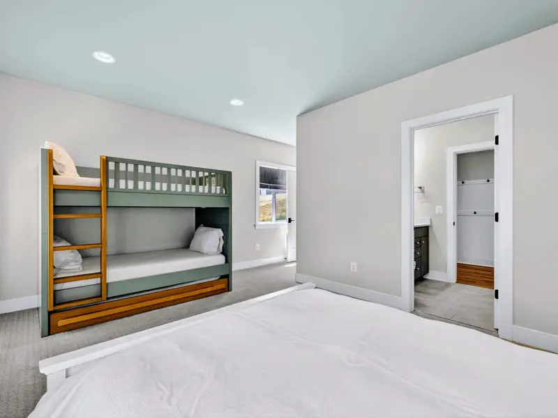 Bunk Room - A green bunk and open floor space make a fun spot for the kids.