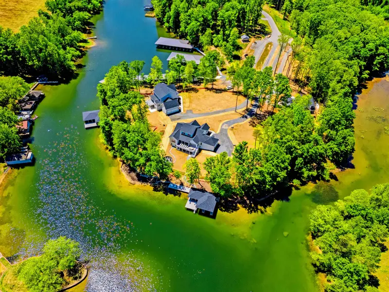 Aerial - The wooded point and private cove from high above, with 400 feet of shoreline and panoramic views.