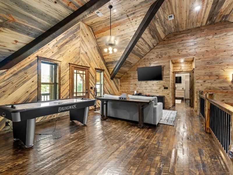 Family fun awaits in our upstairs loft with TV and air hockey table