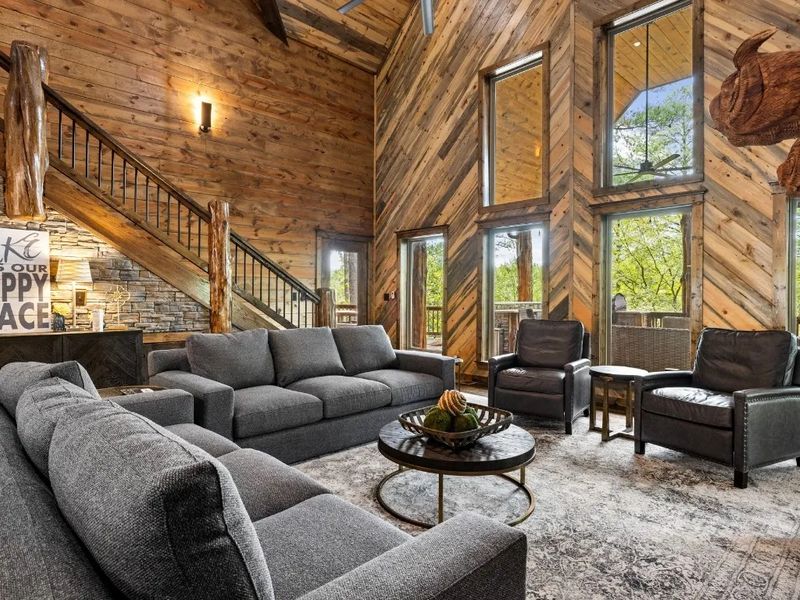 Gather around in our cabin living room, where forest views and good company make memories.
