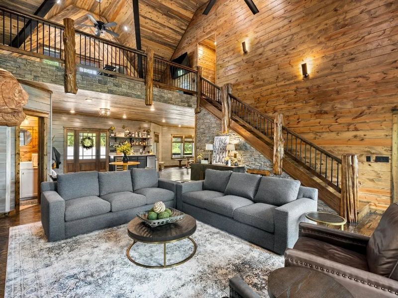 Sink into comfort in our modern cabin's cozy sofas, where relaxation awaits