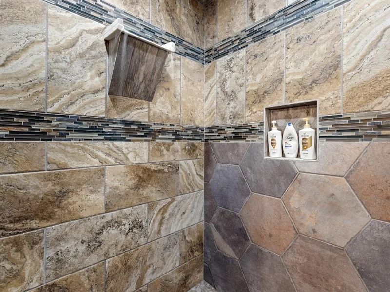 Relax and rejuvenate under the soothing cascade of our walk-in shower with a comforting rain head