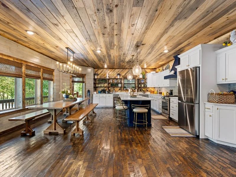 Our open plan kitchen and dining area sets the stage for endless culinary delights, family meals, game nights, and heartfelt conversations