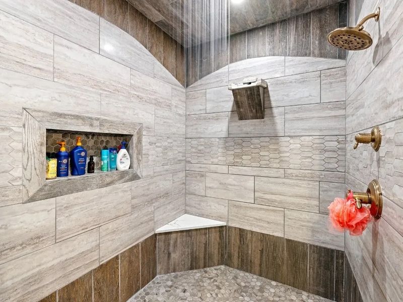Unique waterfall feature in large walk-in shower